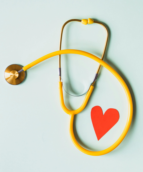 A colorful stethoscope arranged around a red paper heart